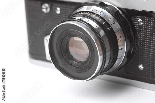 vintage film camera with lens on white