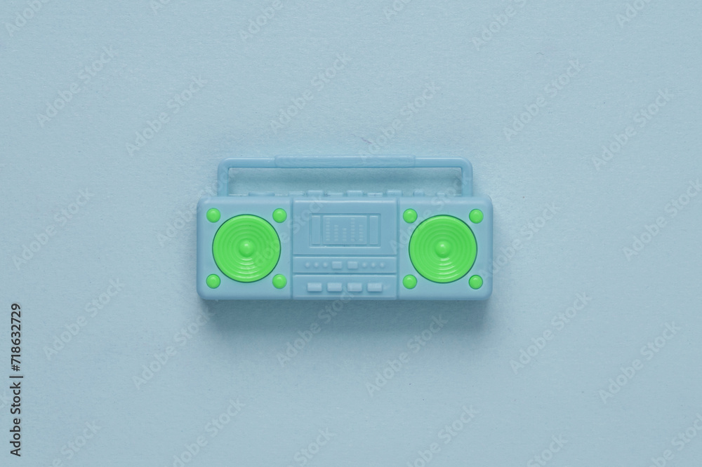 Doll boombox recorder on a blue background. Music concept Doll boombox recorder on a blue background. Music concept