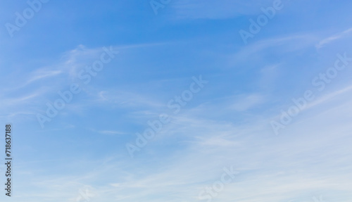 White clouds spread thinly in the blue sky photo
