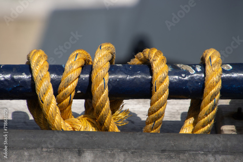 Close up of a rope slung around a pole photo