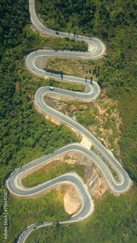 Top view of scenic winding mountain road on the Ha Giang Loop, North Vietnam. photo