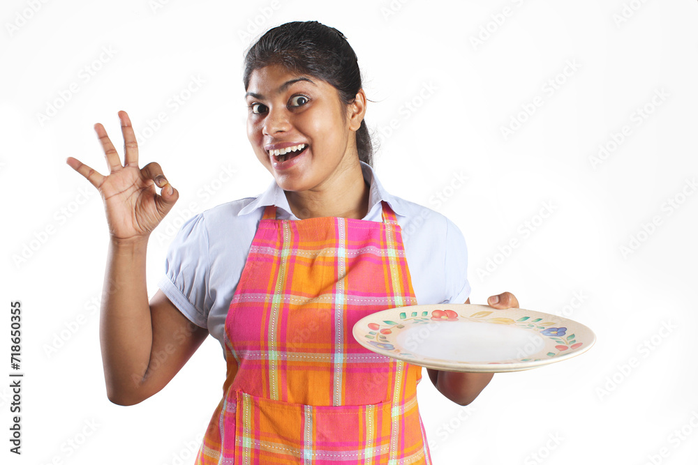 Woman chef in action. Wow, Perfect, tasty, appetizing, delicious, food, Gesture, hand, action and face expression of women chef model. Modern Model holding empty plate and pointing action. Woman chef in action. Wow, Perfect, tasty, appetizing, delicious, food, Gesture, hand, action and face expression of women chef model. Modern Model holding empty plate and pointing action.