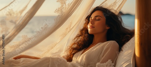 Woman relaxing and sleeping in the meadow by the sea beachlifestyle and vacation concept photo