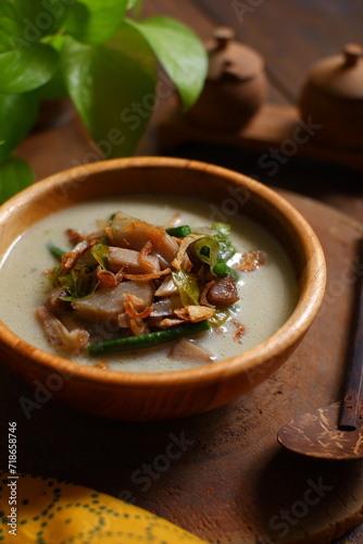 a bowl of sayur nangka muda on wooden table 