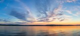 Breathtaking panoramic view of a vibrant and captivating sunset sky with beautifully blended colors