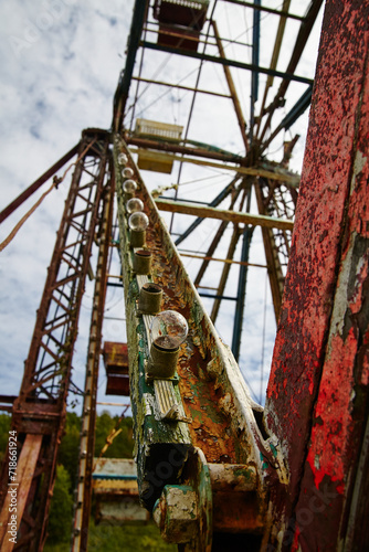 Rustic Abandoned Ferris Wheel, Weathered Paint and Decay, Upward View