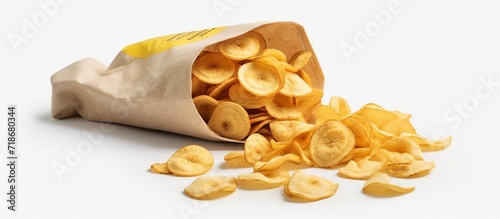 Banana chips. Fruit yellow food. Packaging of snacks. Bundles of chip fly. Delicacy for vegetarians photo
