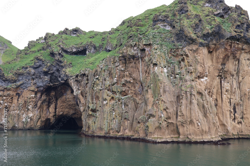 Steep cliff on the coast of Heimaey island- Vestmannaeyjar- Westman Islands-Iceland   