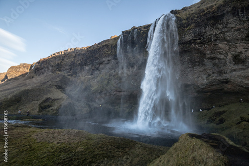view of the shaded waterfall complex Seljalandsdoss  Iceland