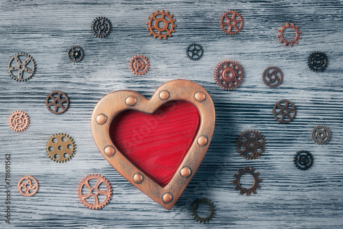 Steampunk Heart with Gears on tectured wooden background