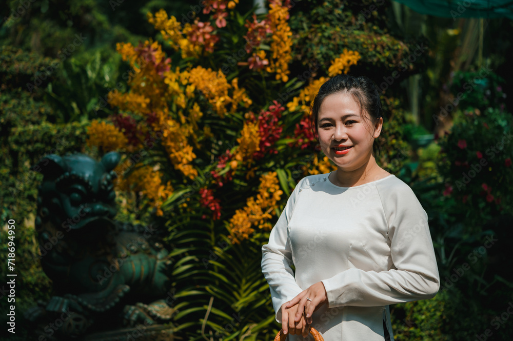 Fototapeta premium Vietnamese woman wearing national dress ao dai portrait
