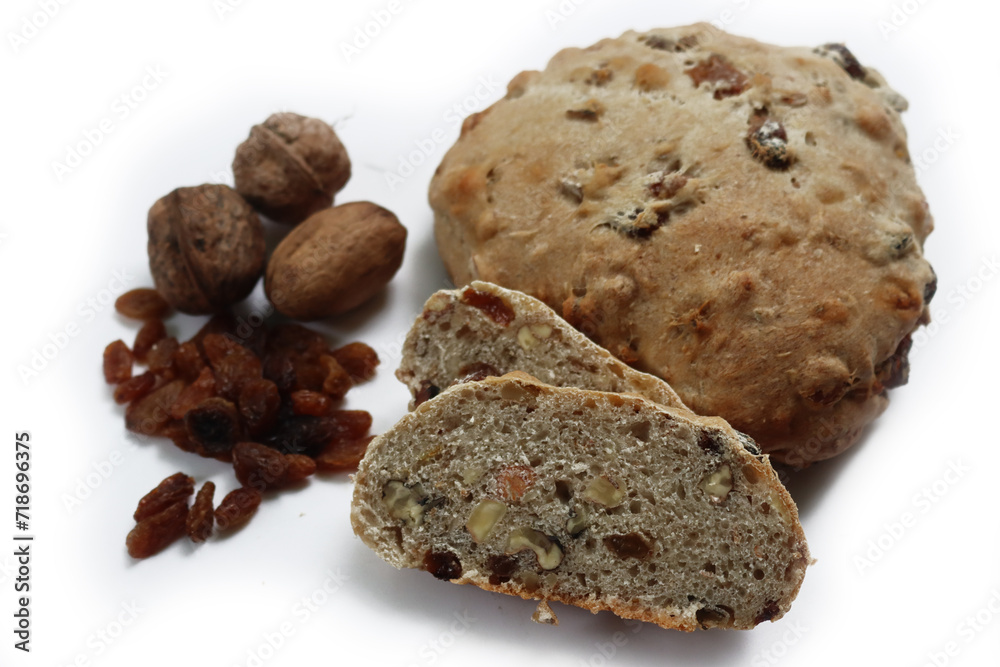 Homemade sliced Pan co' Santi from Tuscany (Italy) isolated on white background. Traditional sweet bread with raisins, almonds, walnuts and aniseed and Vinsanto Homemade sliced Pan co' Santi from Tuscany (Italy) isolated on white background. Traditional sweet bread with raisins, almonds, walnuts and aniseed and Vinsanto