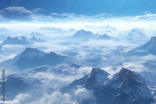 Beautiful aerial view of clouds and mountain peaks in the blue sky
