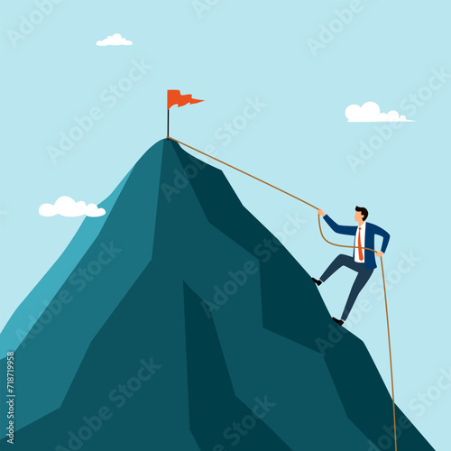 Businessman climbing on the rock. Young brave man wearing business suit trying to reach the top of the mountain. Concept of business challenge.