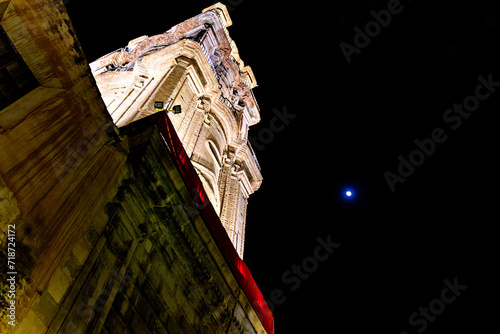 Tower of the Church of San Juan Bautista in Malaga, Andalusia. Night photo, selective focus 