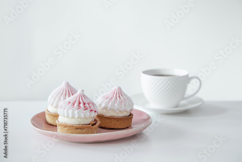 cupcakes with cup of coffee on white table