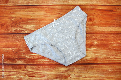 Photos Cotton gray panties on wooden background