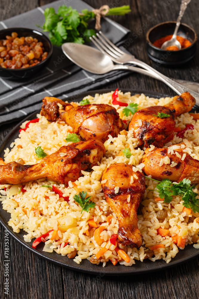 fried chicken drumsticks over rice pilaf, top view