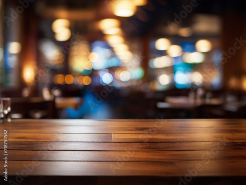 cafe bar in the night. table in restaurant. Top of Wooden table with Blurred Bar Interior restaurant background.