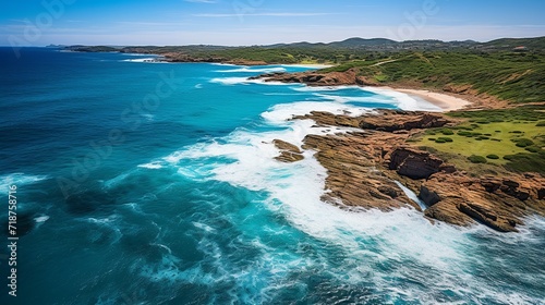 Aerial view of waves rolling on the shoreline.