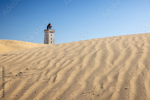 lighthouse Rubjerg Knude Fyr behind the dunes at the beach of lokken jutland denmark