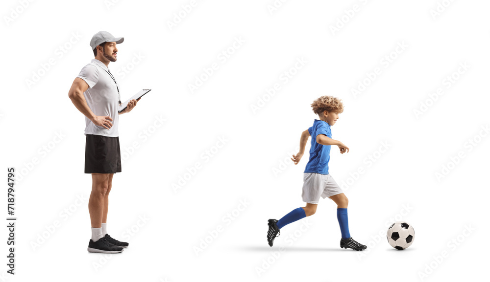 Coach watching a boy at football training Coach watching a boy at football training