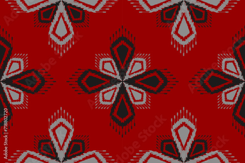 Fabric flower ikat pattern art. Ethnic red seamless pattern traditional. American, Mexican style. Design for background, illustration, clothing, carpet, rug, batik, embroidery.