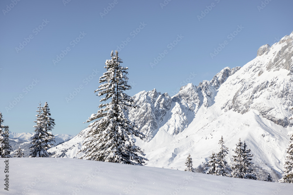Snowy wintertime landscape and high iconic mountain peaks. Austrian Alps