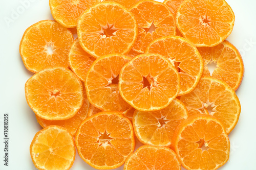juicy and appetizing tangerines cut into circles as a food background 1