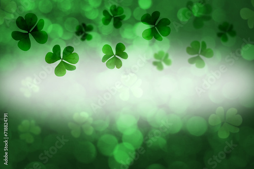 St. Patrick's Day greeting card design with clover leaves, bokeh effect