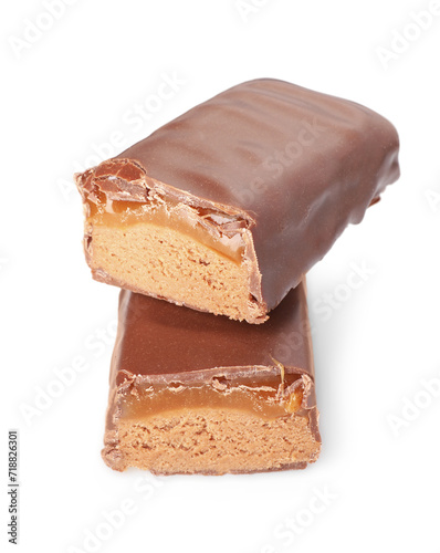 Pieces of tasty chocolate bars with nougat on white background