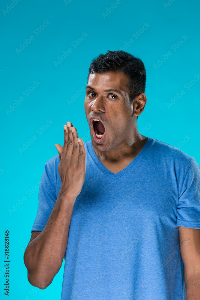 Tired Indian man yawning. Tired Indian man yawning.
