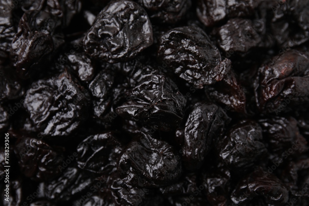 Sweet dried prunes as background, closeup view Sweet dried prunes as background, closeup view