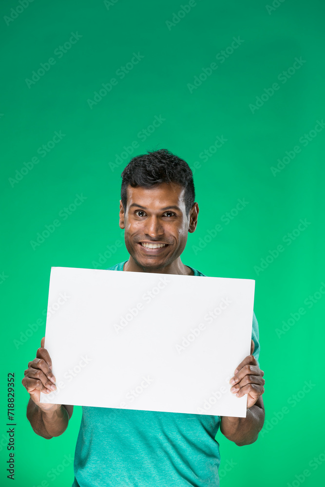 Indian man holding up a banner. Indian man holding up a banner.