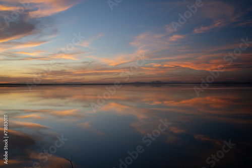 End of the day on a lake  sunset and light in the clouds- Tunisia