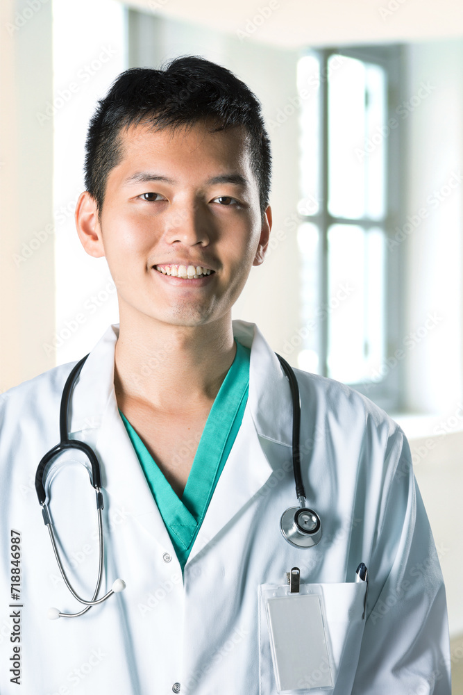 A happy Asian healthcare worker stands confidently in a brightly lit hospital, A stethoscope hangs around his neck, and a clipboard held firmly in his hand suggests he is ready to attend to patients A happy Asian healthcare worker stands confidently in a brightly lit hospital, A stethoscope hangs around his neck, and a clipboard held firmly in his hand suggests he is ready to attend to patients