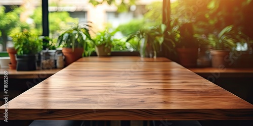 Wooden table in coffee shop can be used for product display/mock-up.