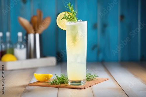 tall glass of lemonade with a lemon twist garnish