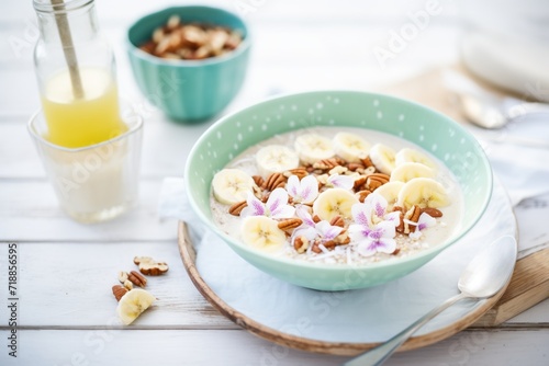 protein smoothie bowl topped with nuts and banana slices