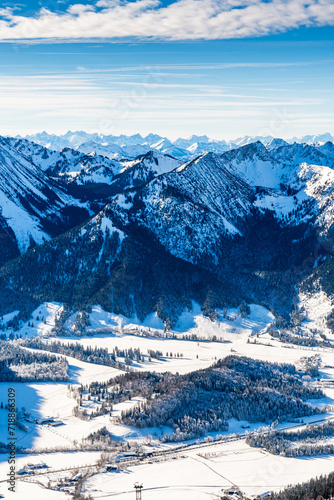 View of the German and Austrian Alps from the 1838 meter high Wendelstein mountain in Germany, vertical with copy space