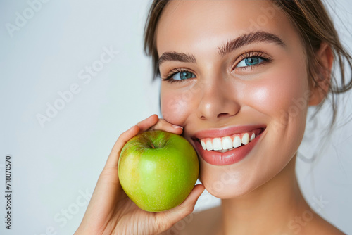 Healthy Living: Portrait of a Woman with Bright Teeth and Fresh Apple
