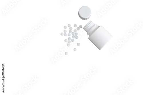 isolated shot of spilled pills coming out of a white plastic bottle on transparent background