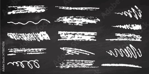 Hand-drawn underlining elements, brush with crayon effect, chalk texture on chalkboard background. Chalk stroke. Vector illustration in children's style. Crayon brush white underline. photo
