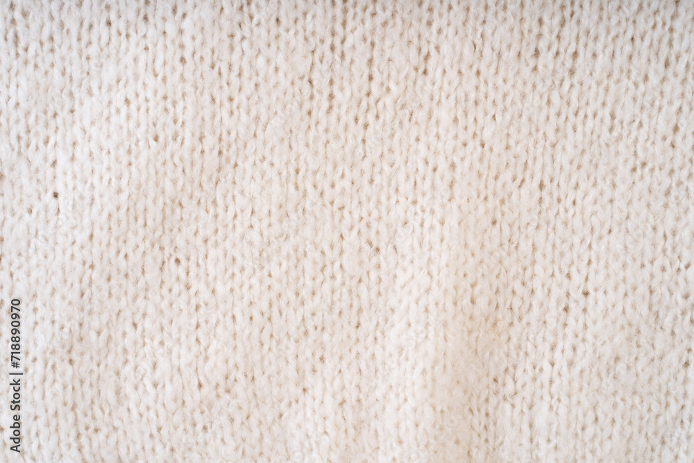 Textile natural wool white background. Clothes made from natural fabric. Textile natural wool white background. Clothes made from natural fabric.
