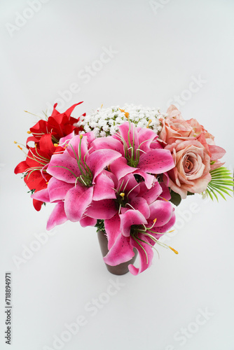 bouquet of flower in vase isolated on white photo