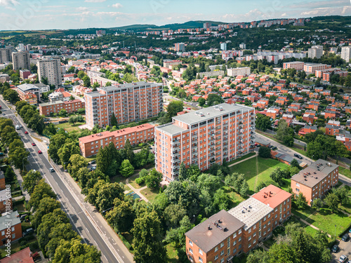 Фотография Zlin’s cityscape with a blend of urban structures and green spaces, with forested hills in the distance