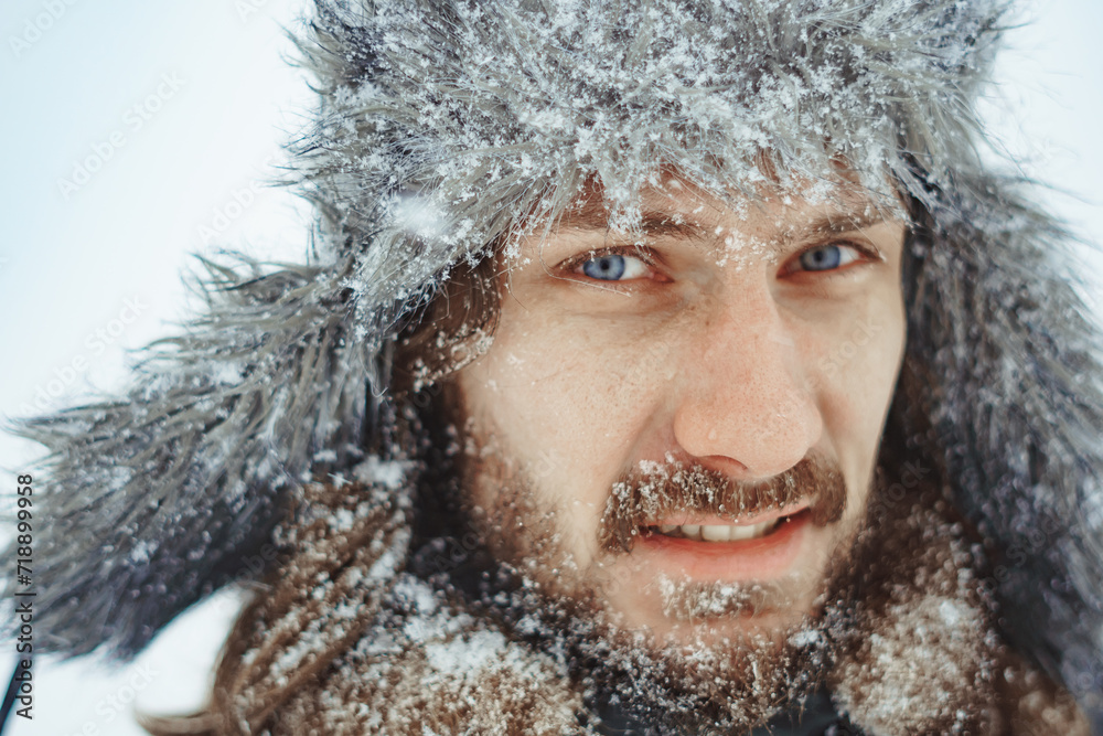 a bearded man in an earflap in winter a bearded man in an earflap in winter