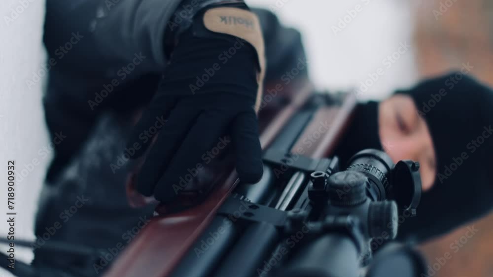 A shooting instructor shooting instructor aims at an optical sight A shooting instructor shooting instructor aims at an optical sight