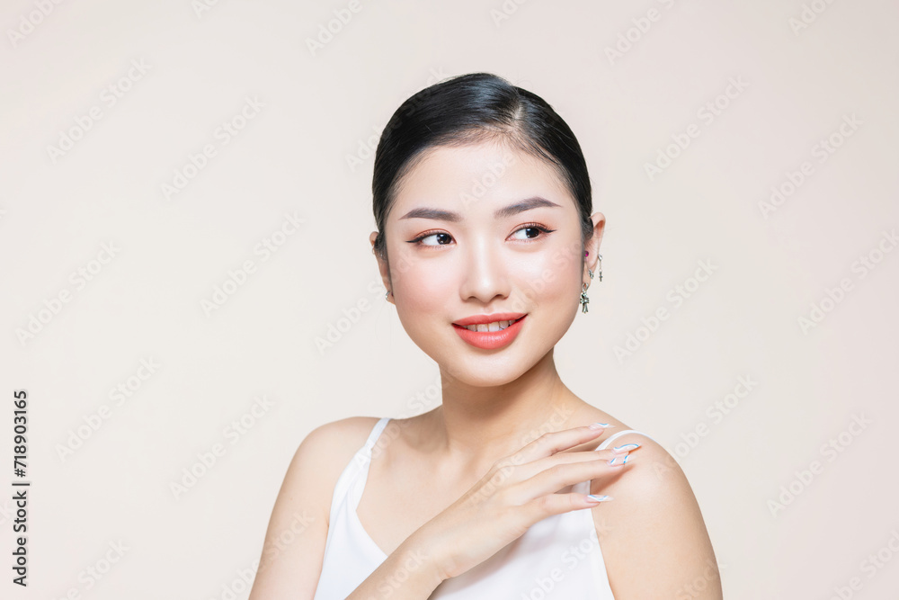 Skin protection, Young asian woman's hand is touching her smooth skin on the shoulder Skin protection, Young asian woman's hand is touching her smooth skin on the shoulder