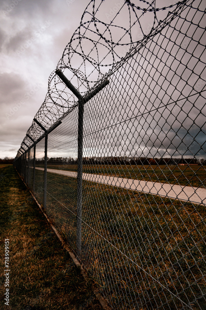 Barbed wire fence on the sunset black and white photography